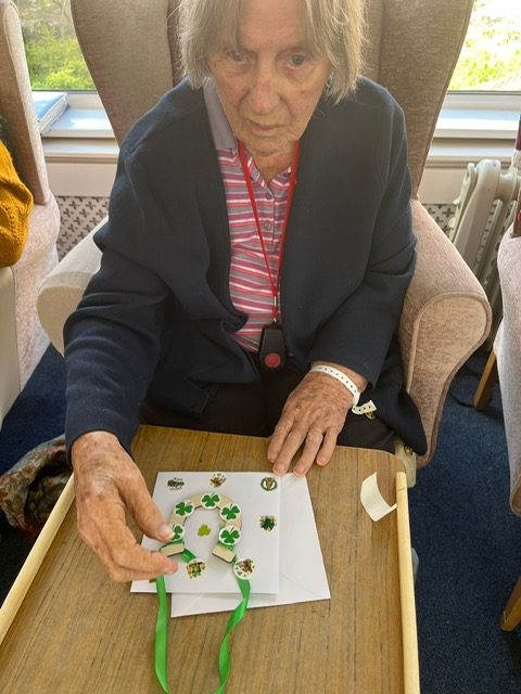 Female resident making charm decoration