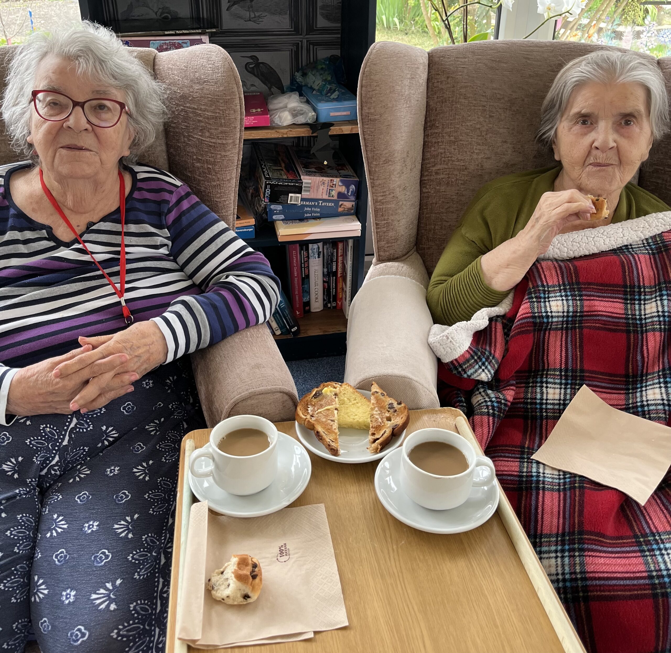 Residents enjoying a slice of sweet loaf and a cup of tea 3 scaled