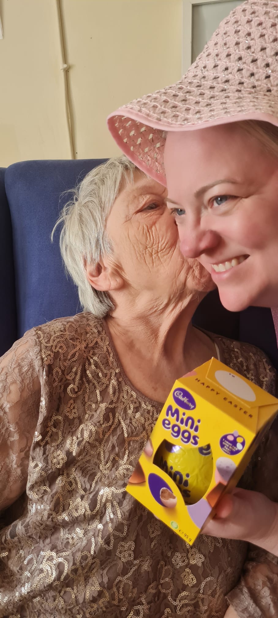 Ange giving Sarah a kiss on the cheek to thank her for the chocolate egg