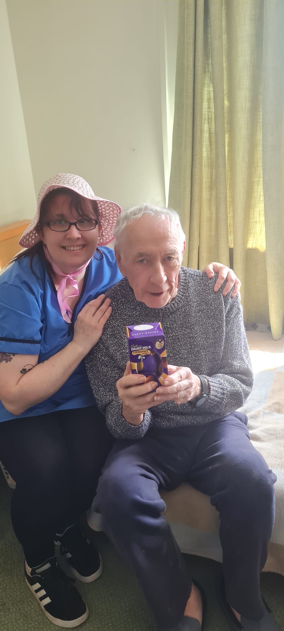 Bob holding a chocolate egg with Paula