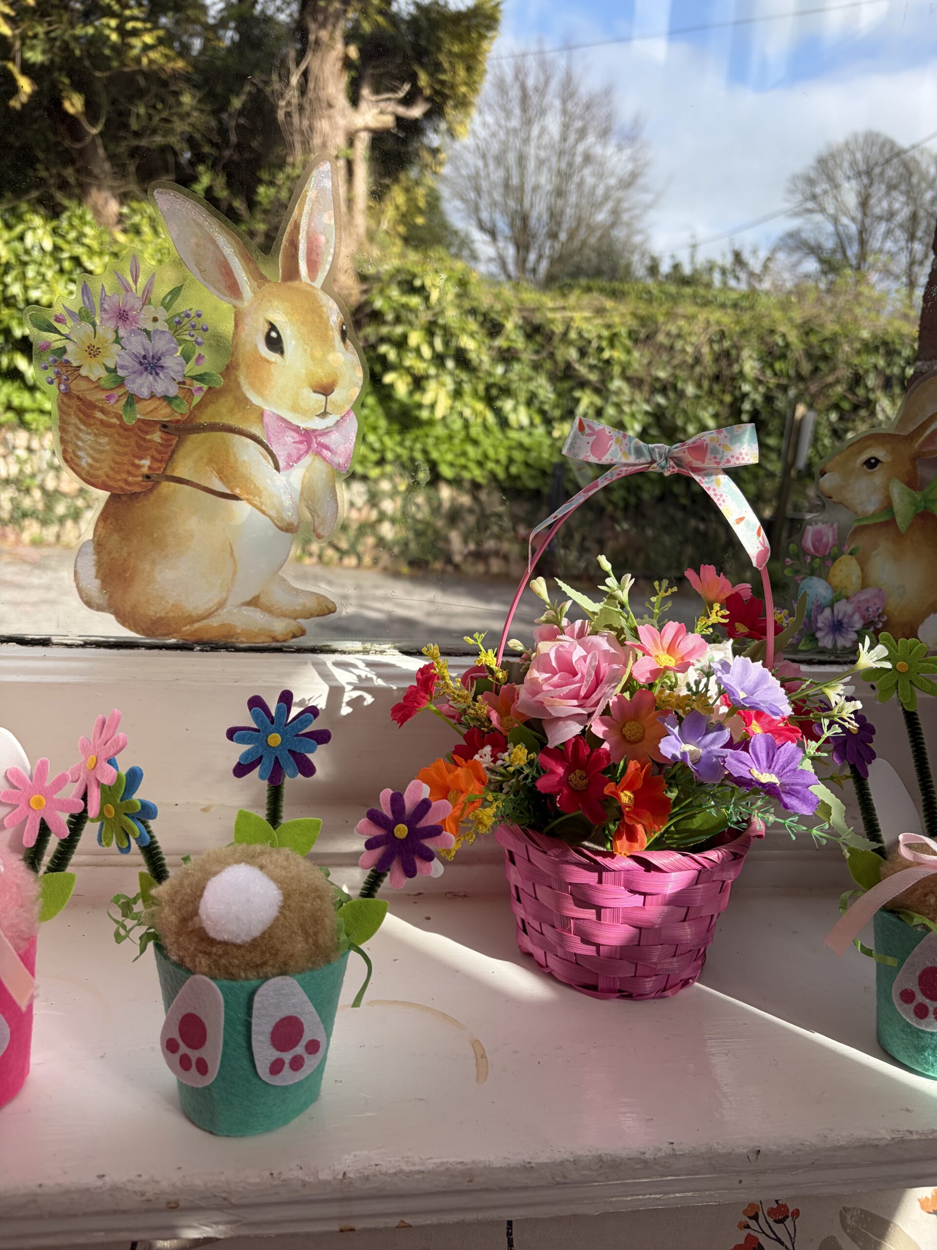 Easter baskets filled with flowers and Easter decorations scaled