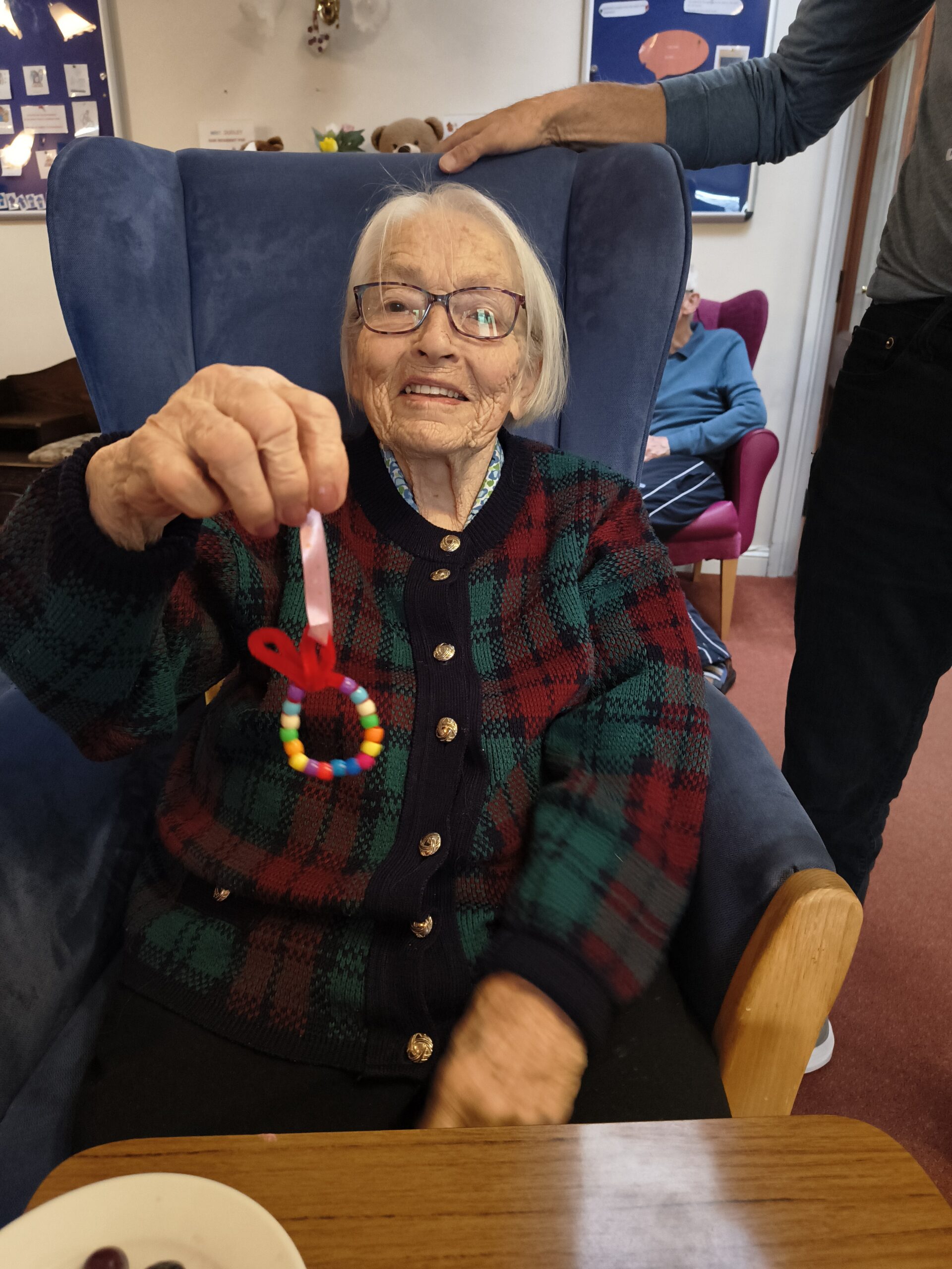 Female resident showing finished bead easter egg 2 scaled