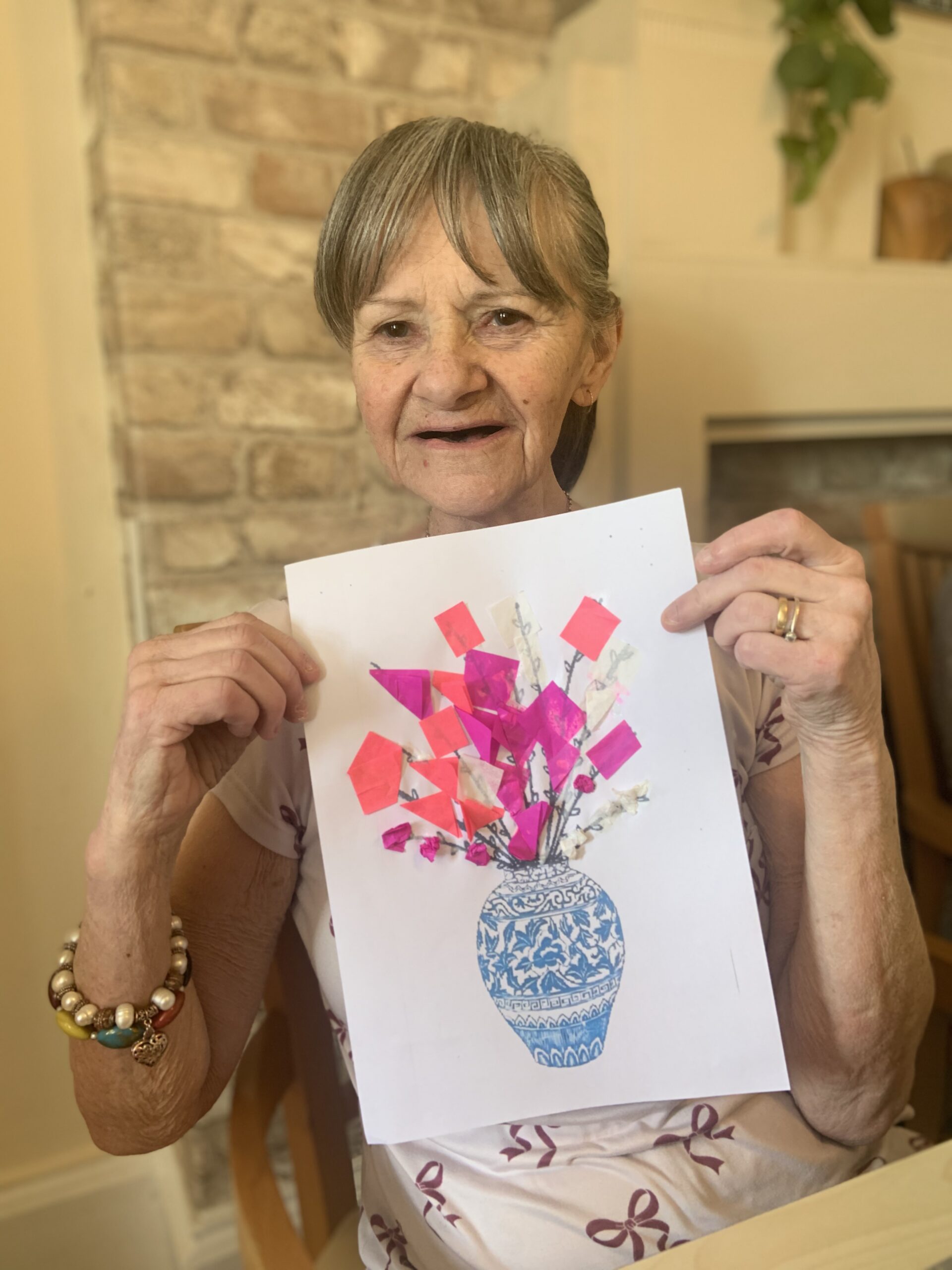 Female resident showing her finished picture scaled