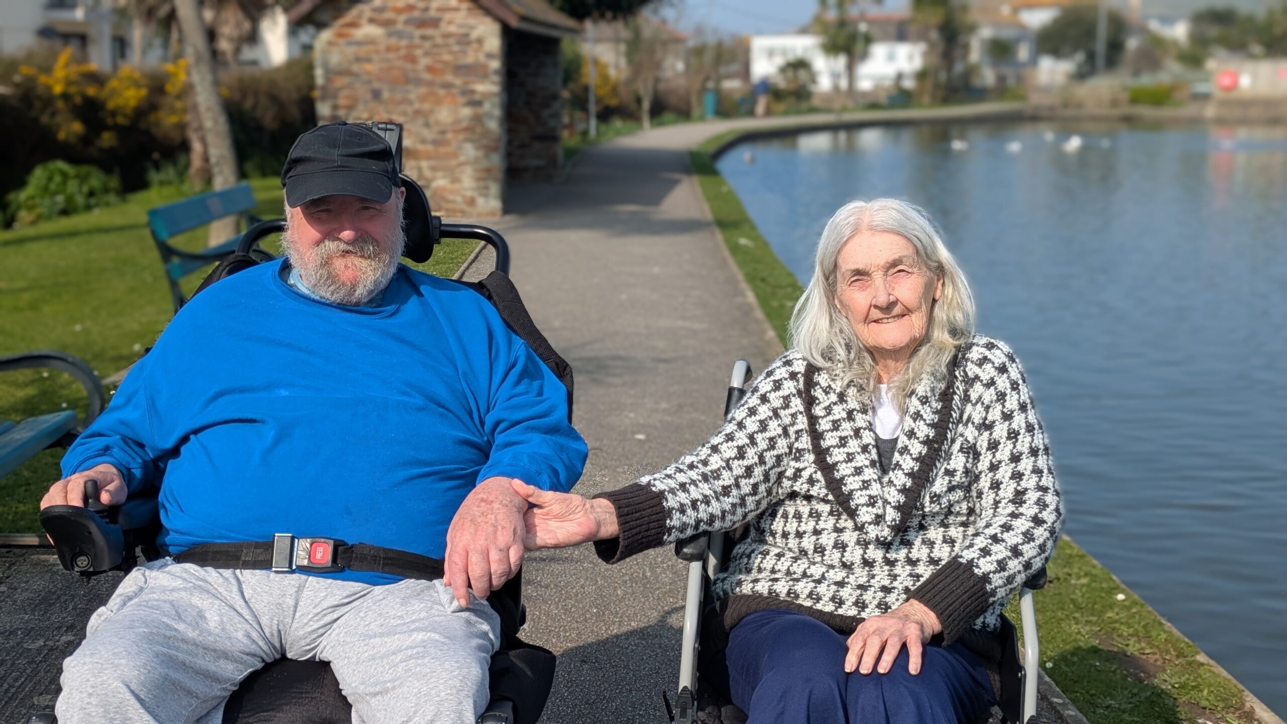 George and Sarah side by side outside at a lake scaled
