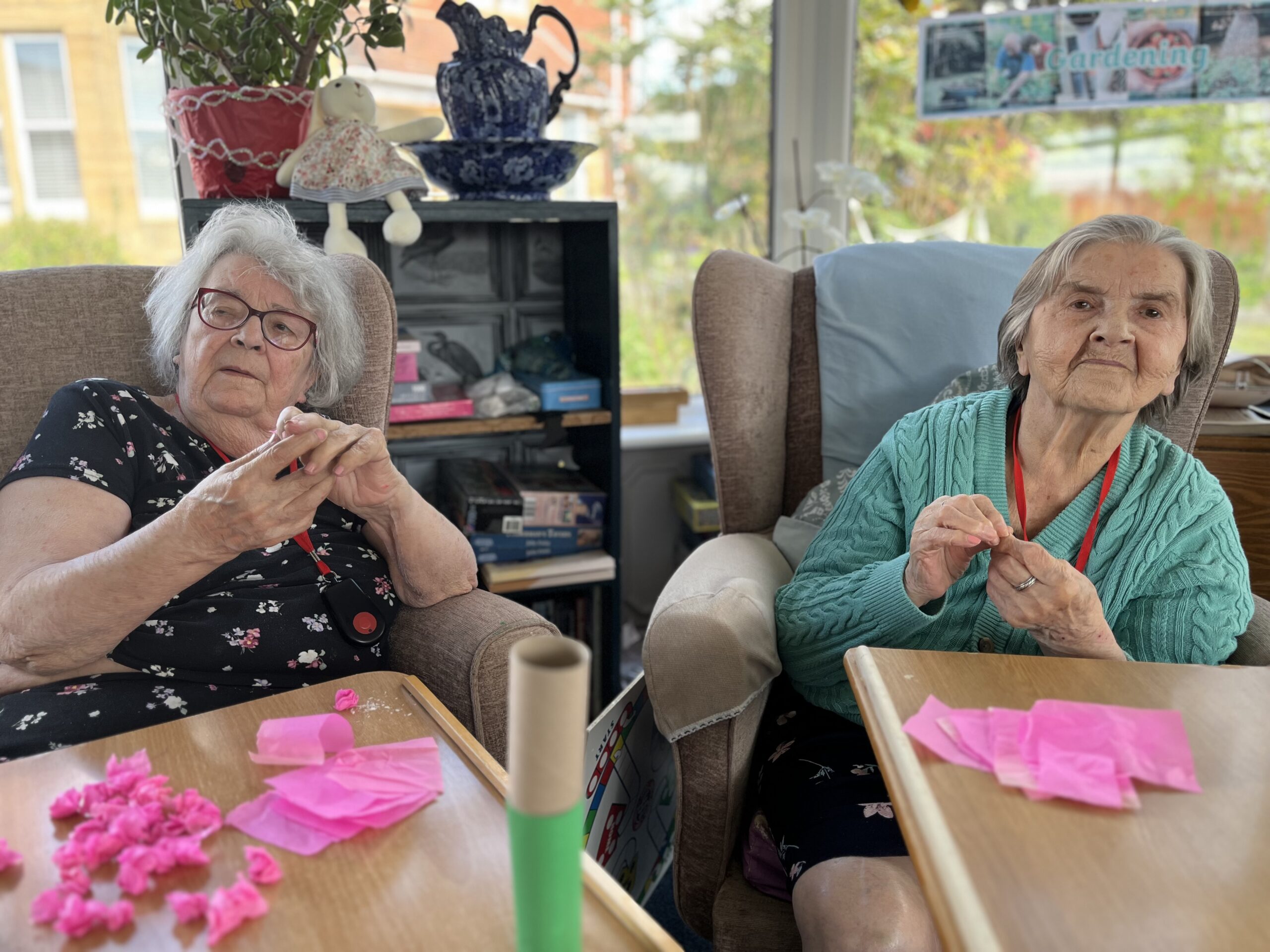 Maggie and Herta scrunching up pieces of pink tissue paper for Hyacinth petals scaled