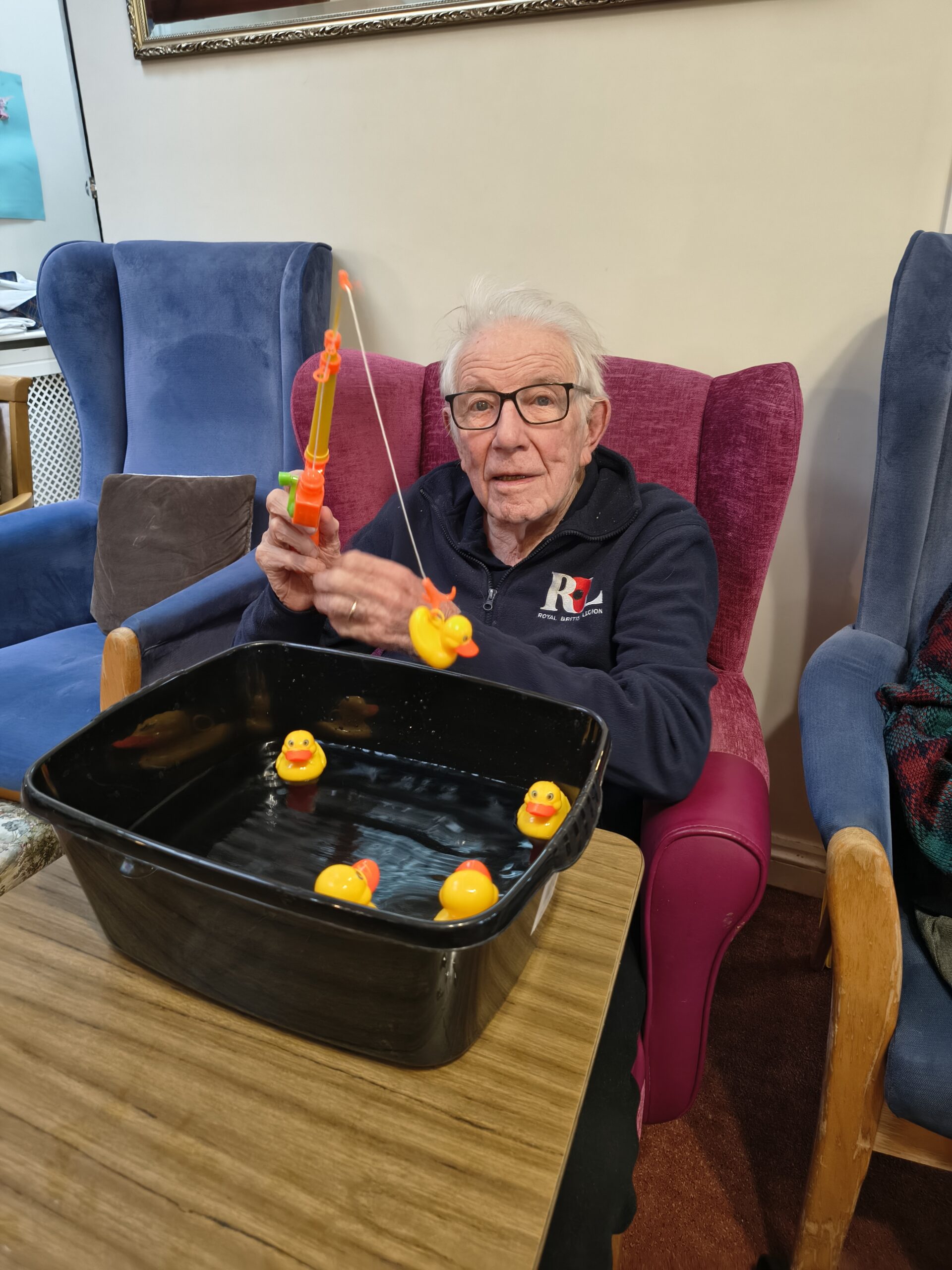 Male resident hooking a duck from the bowl scaled