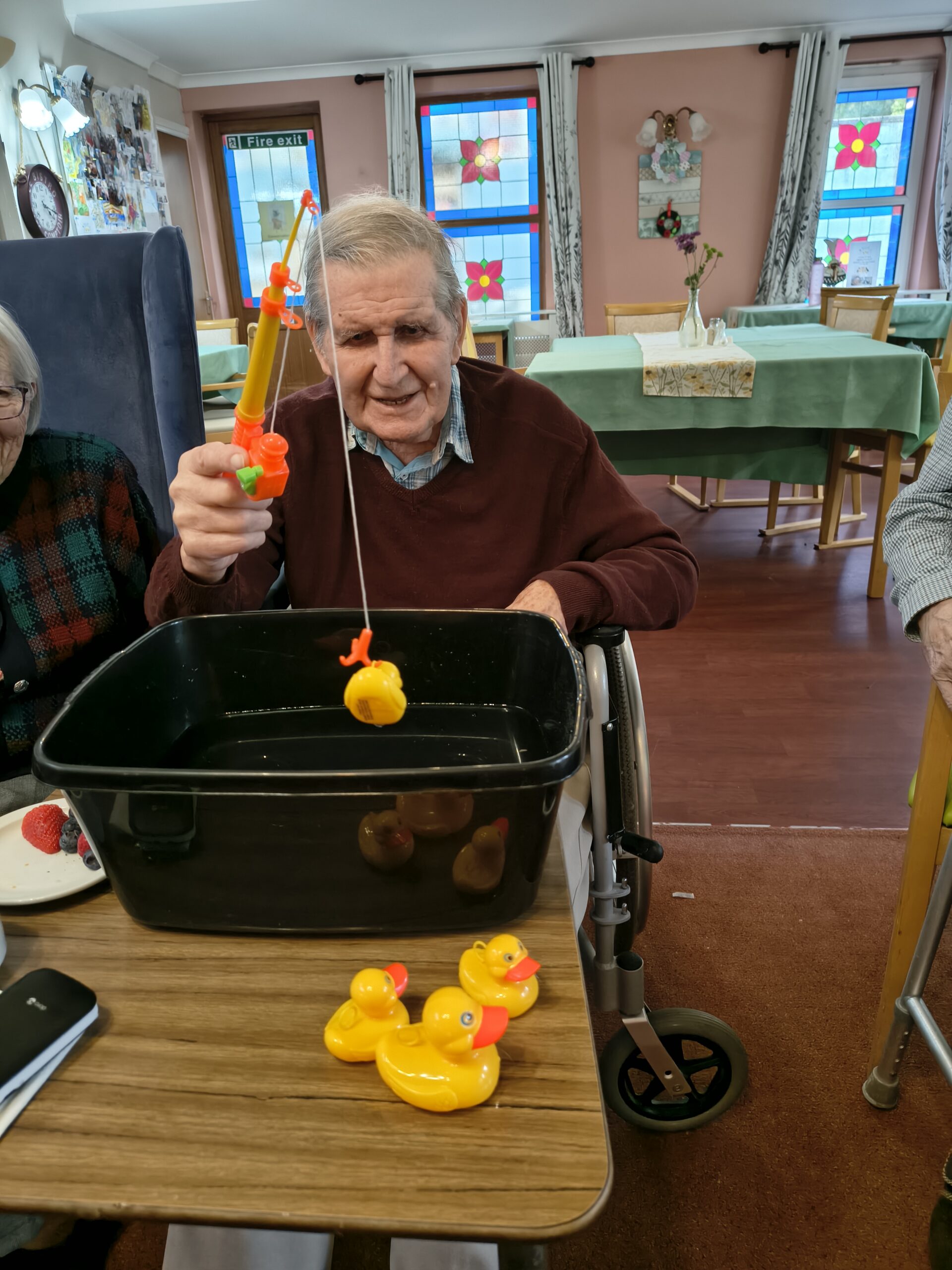 Male resident hooking the last duck from the bowl scaled