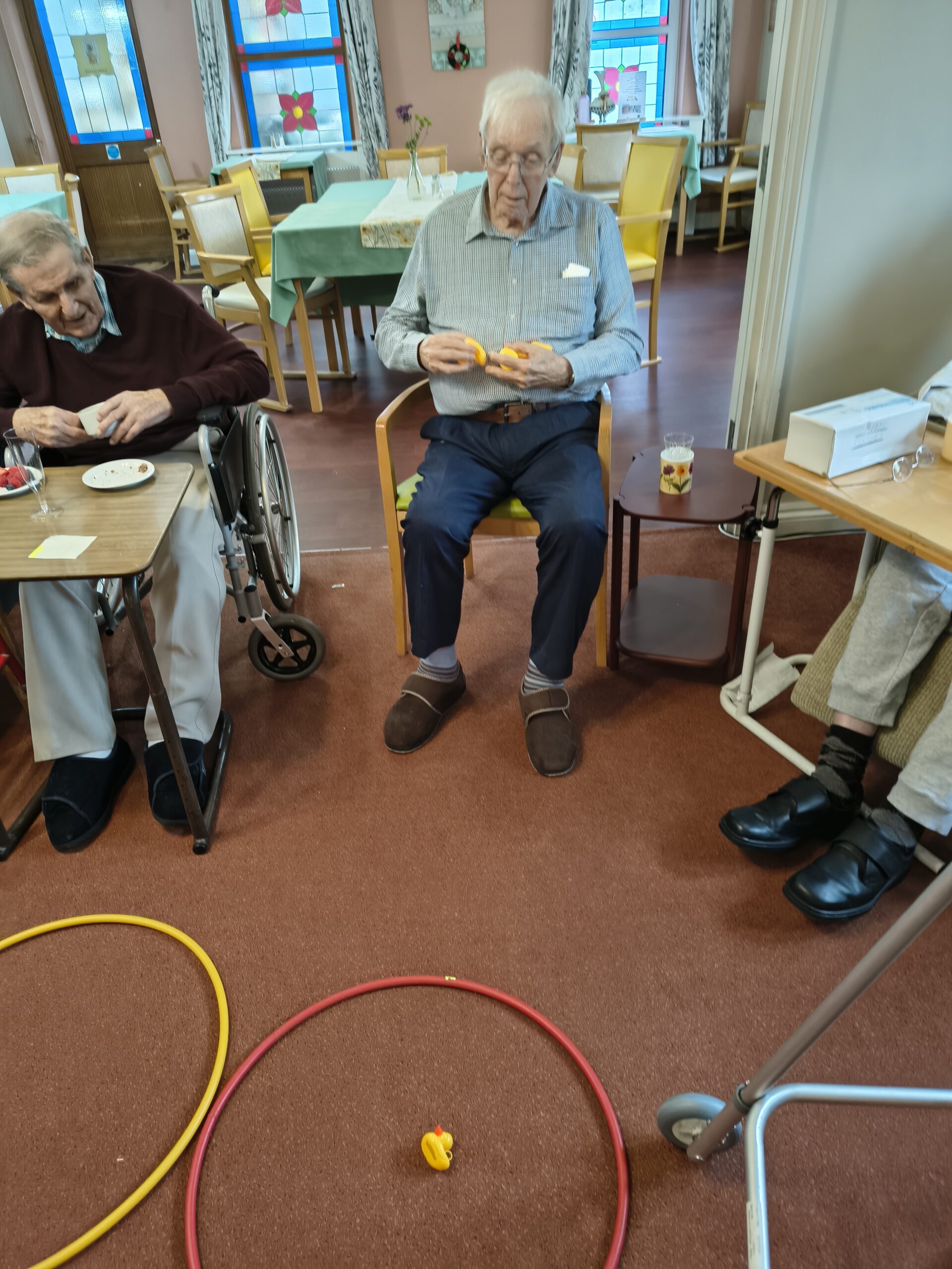 Male resident throwing a duck into a hoop on the ground Male resident throwing a duck into a hoop on the ground scaled