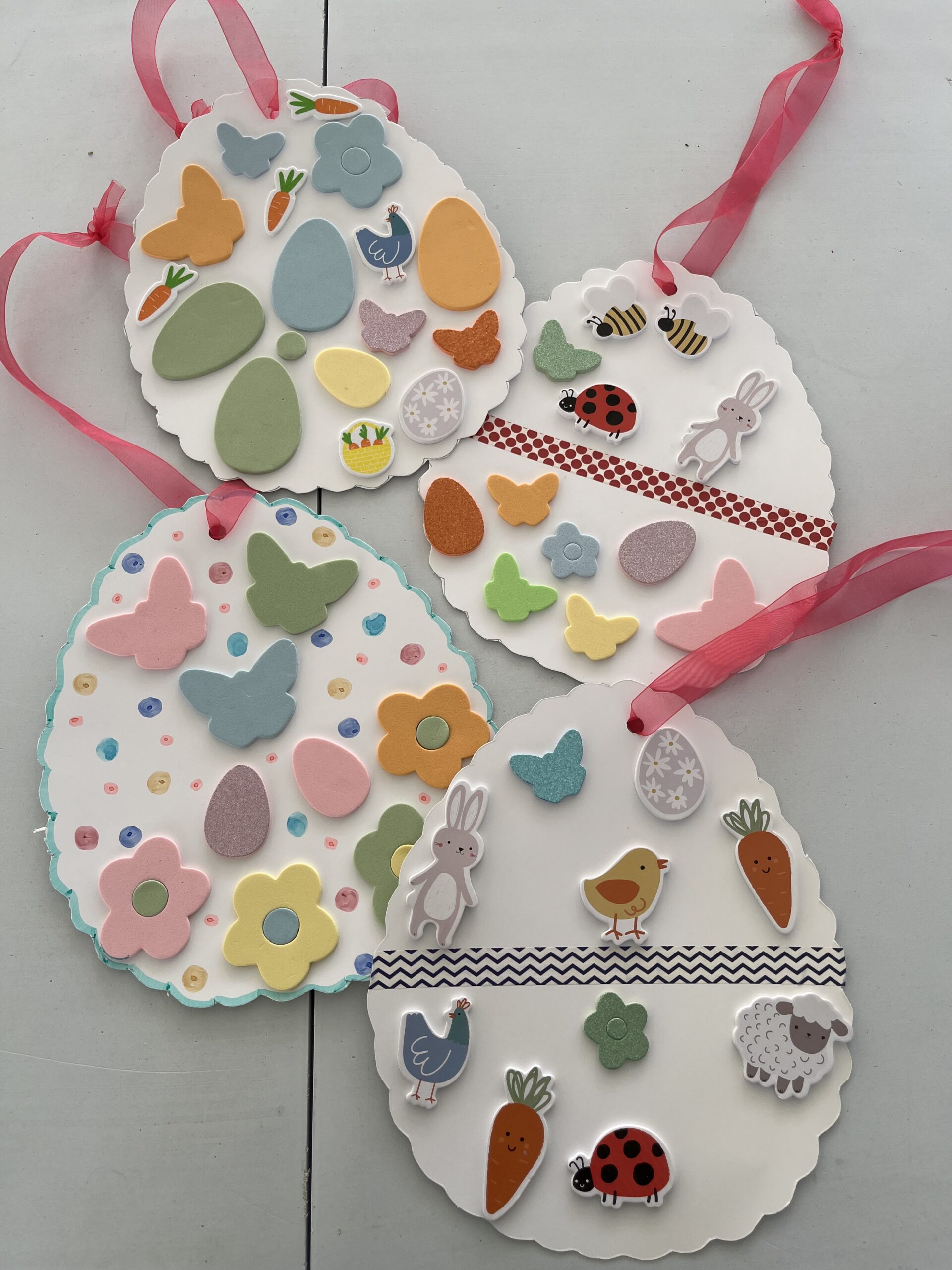 Paper Easter eggs decorated with Easter and spring stickers scaled