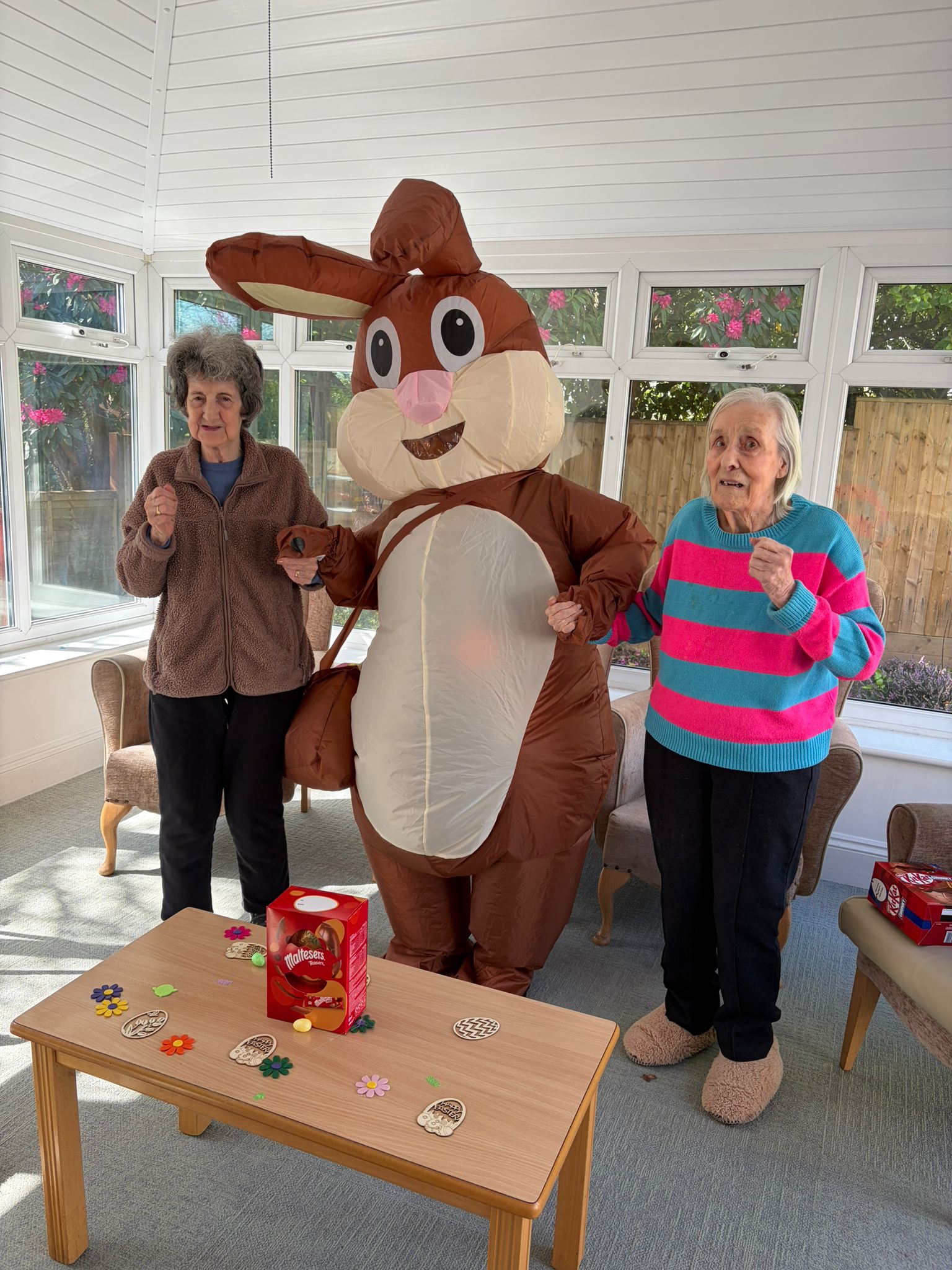 Residents dancing with the Easter bunny in the conservatory 1