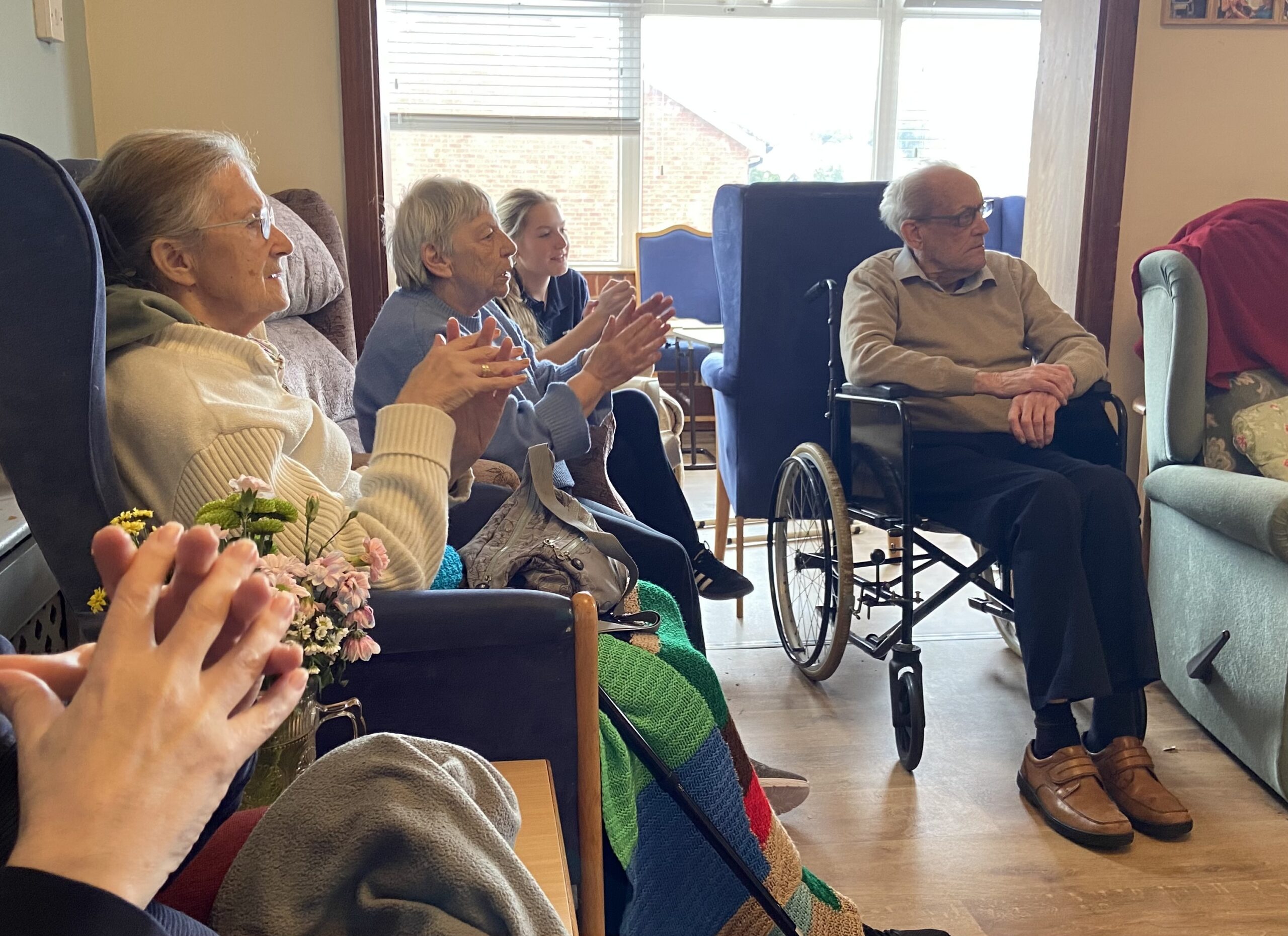 Residents joining in The Hokey Cokey scaled