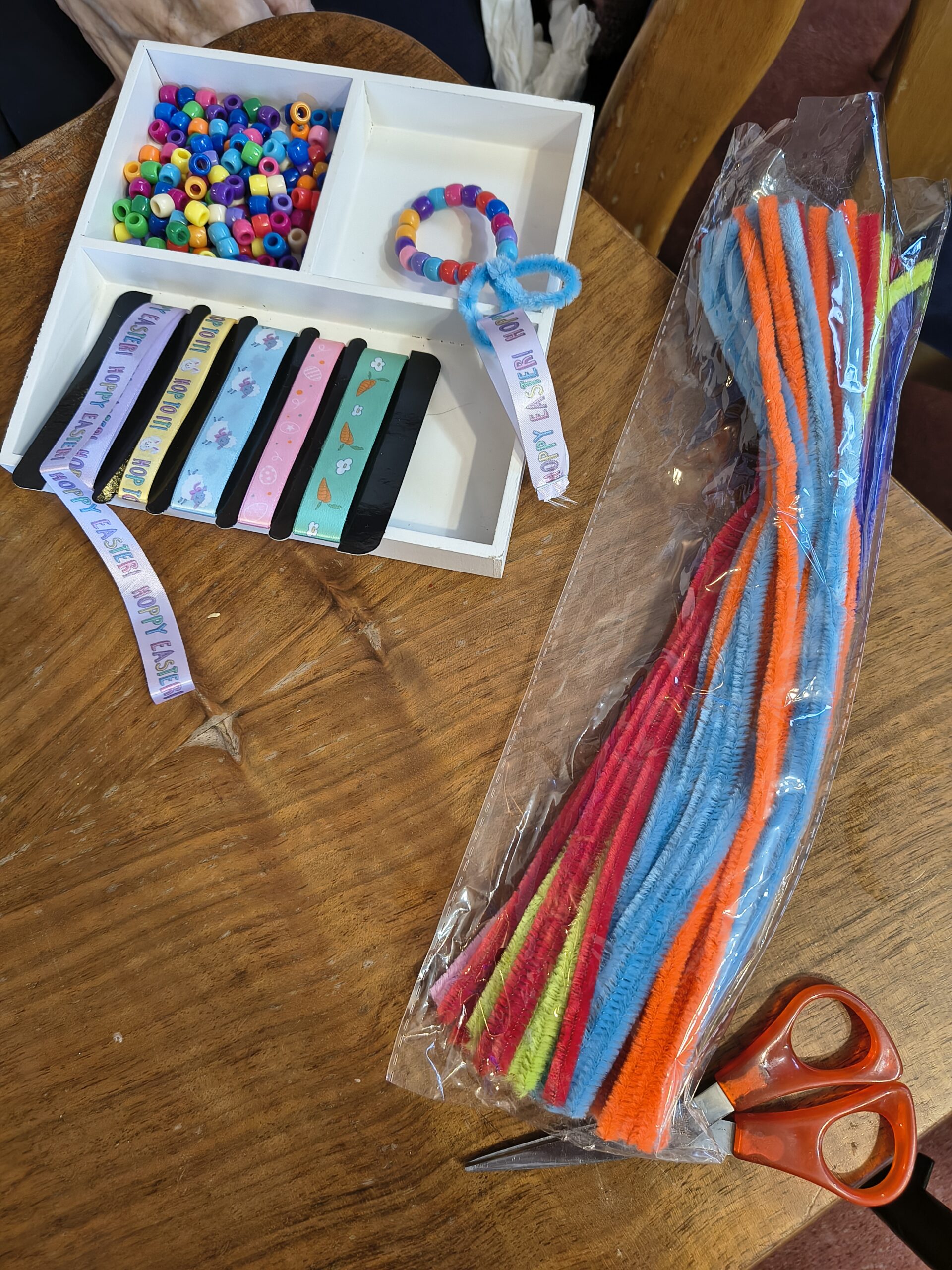 Showing the different materials coloured pipe cleaners and beads and different Easter ribbons scaled