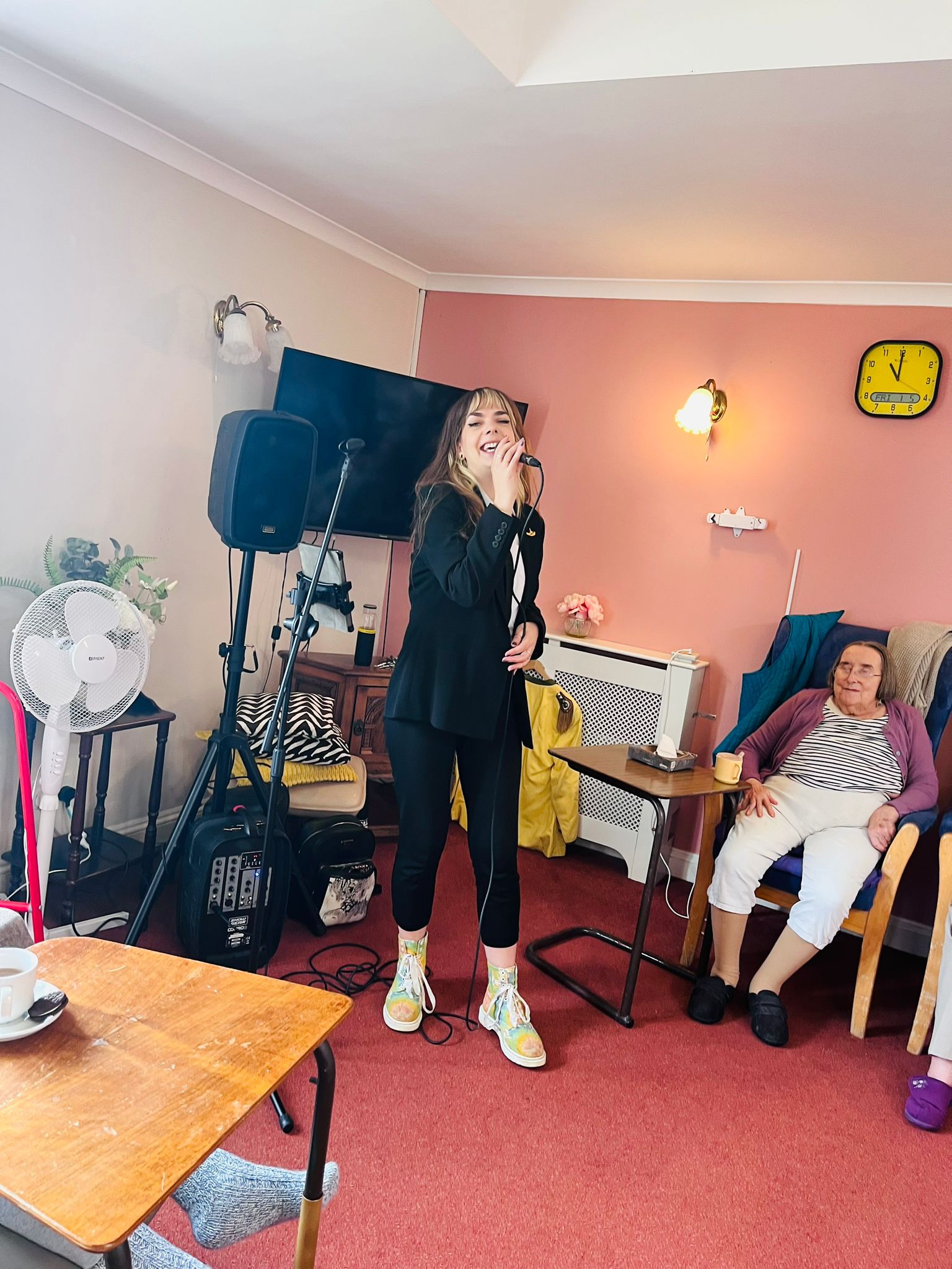 A lady performing Beatles songs for the residents