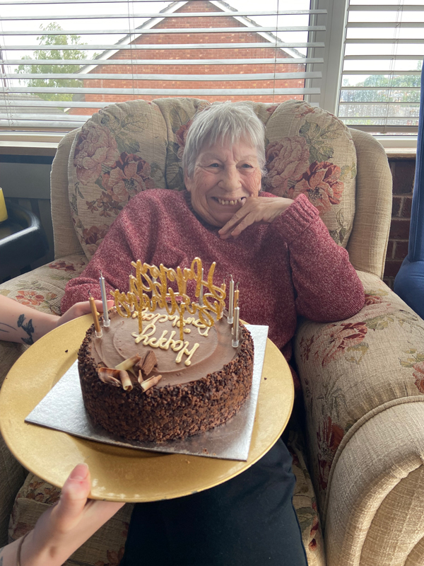 Ange smiling after blowing out the candles