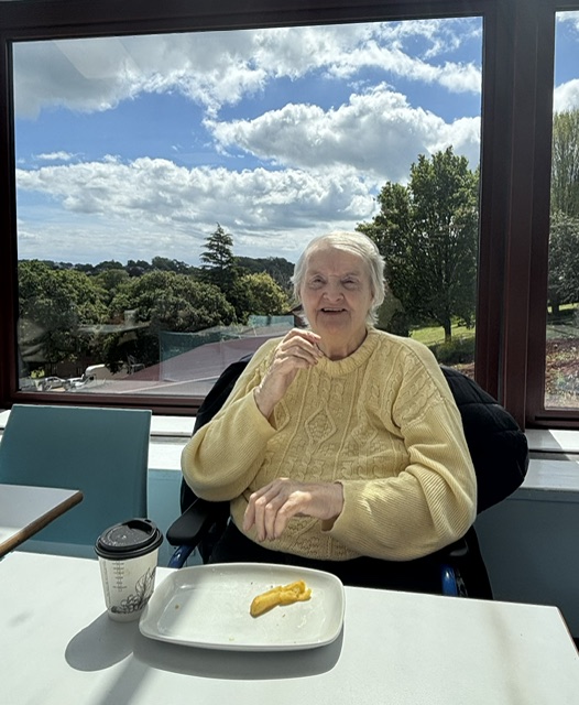 Doris smiling with an empty plate