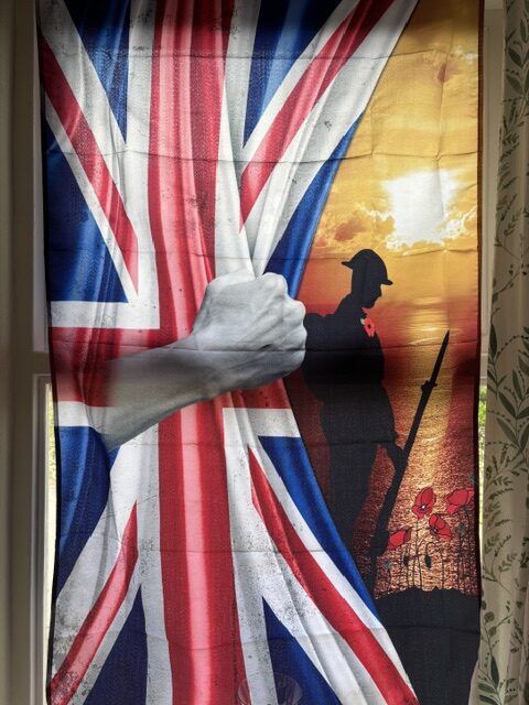 Fabric picture of the Union Jack with a soldier and poppy rotated