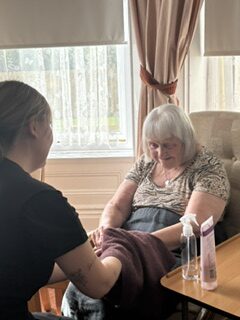 Female resident enjoying her hand massage rotated