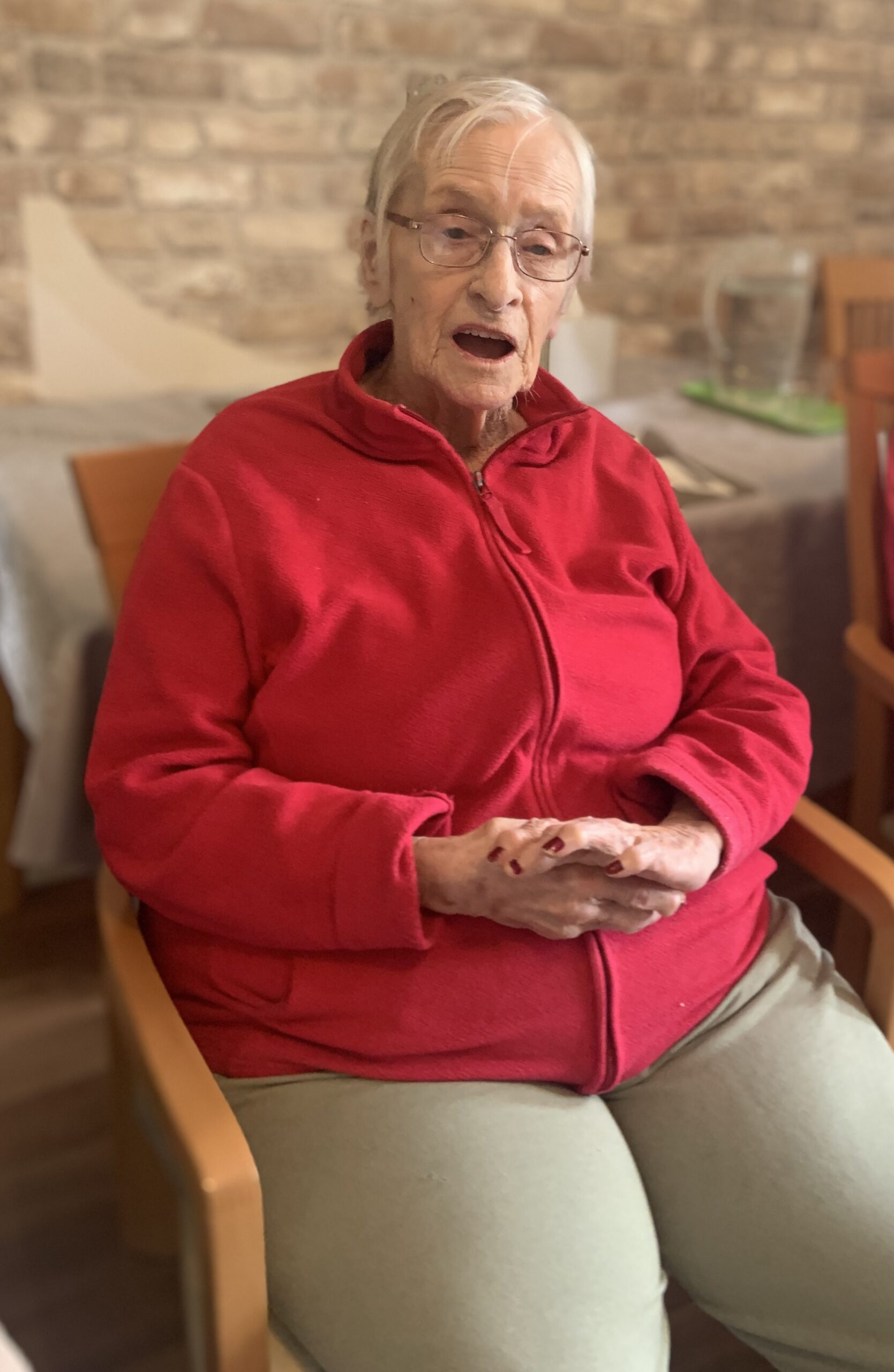 Female resident singing along to the music scaled