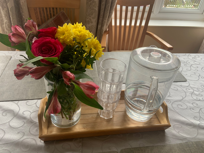 Finished displays of flower filled vases around the care home 2