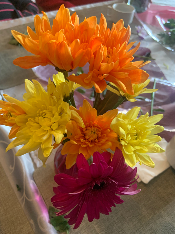 Finished displays of flower filled vases around the care home 3
