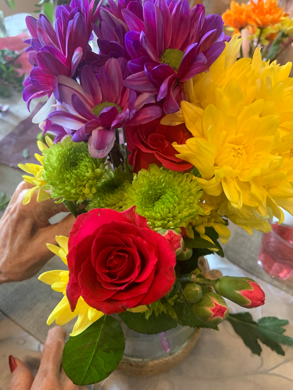 Finished displays of flower filled vases around the care home 4