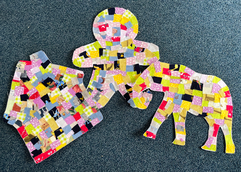 Finished paper patchworks of a house an elephant and a gingerbread man cutout