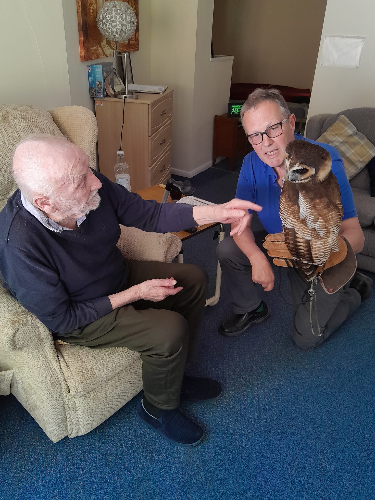 Ivor seated whilst stroking Bill the Owls chest