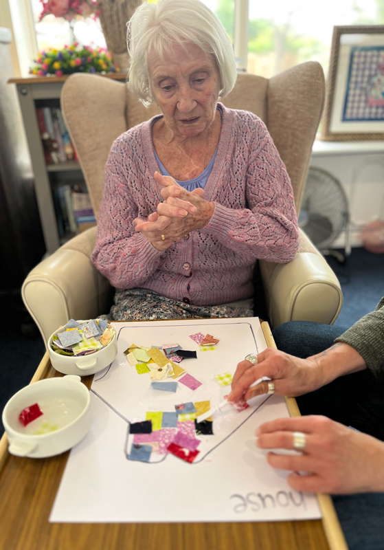 Jean working on her house patchwork