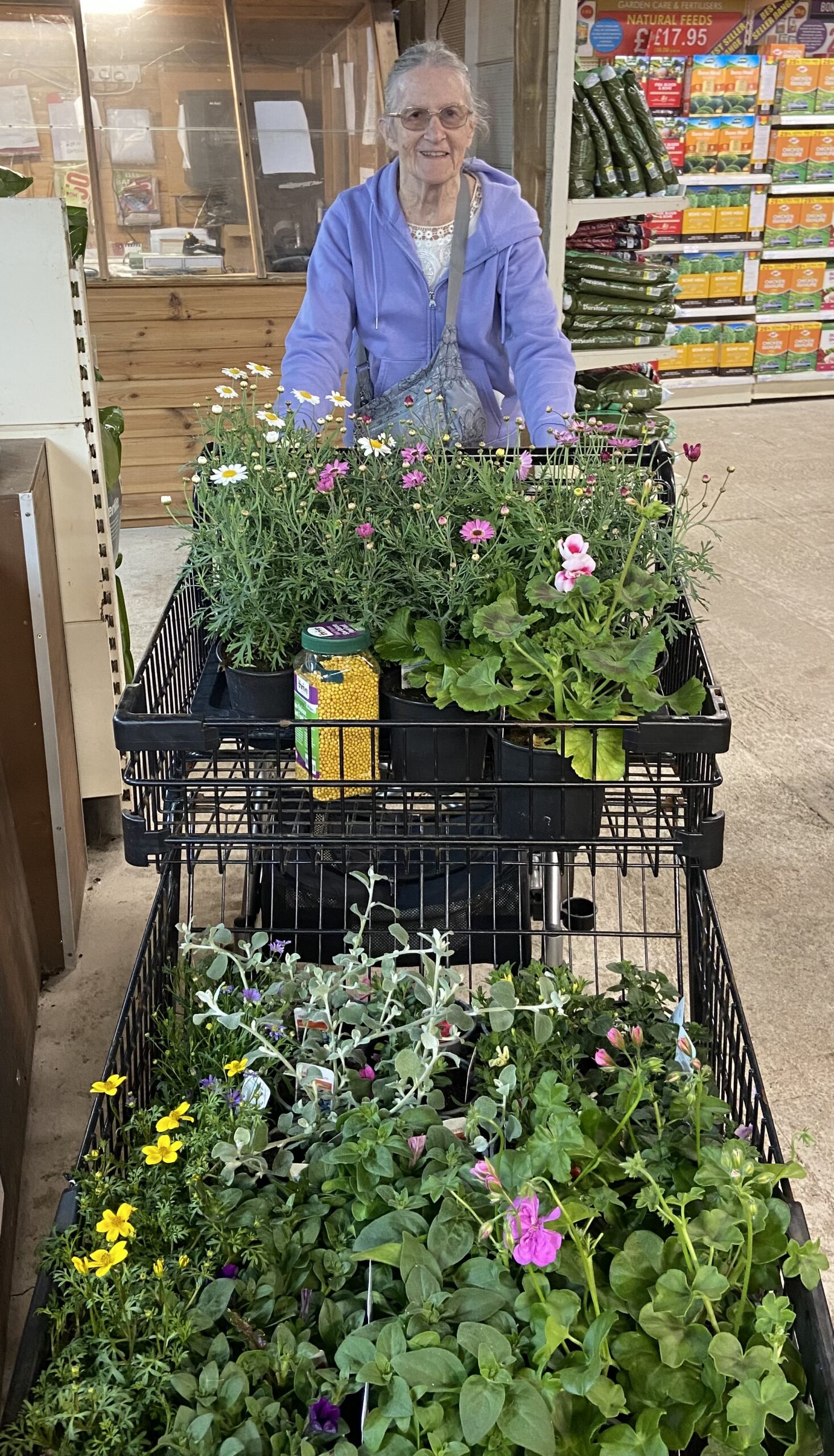 Lesley with a trolley full of plants at Plants Galore scaled