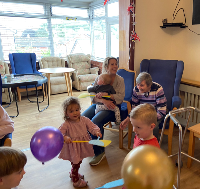Marj talking and playing with the children