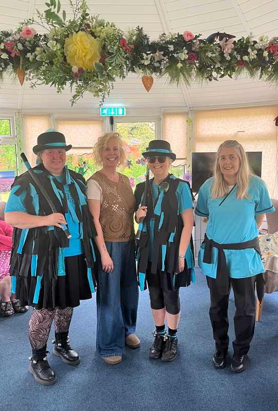 Morris dancers stood smiling for the camera