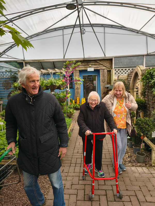 Residents walking around the garden centre talking