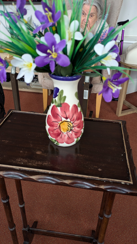 Vase of flowers on a side table