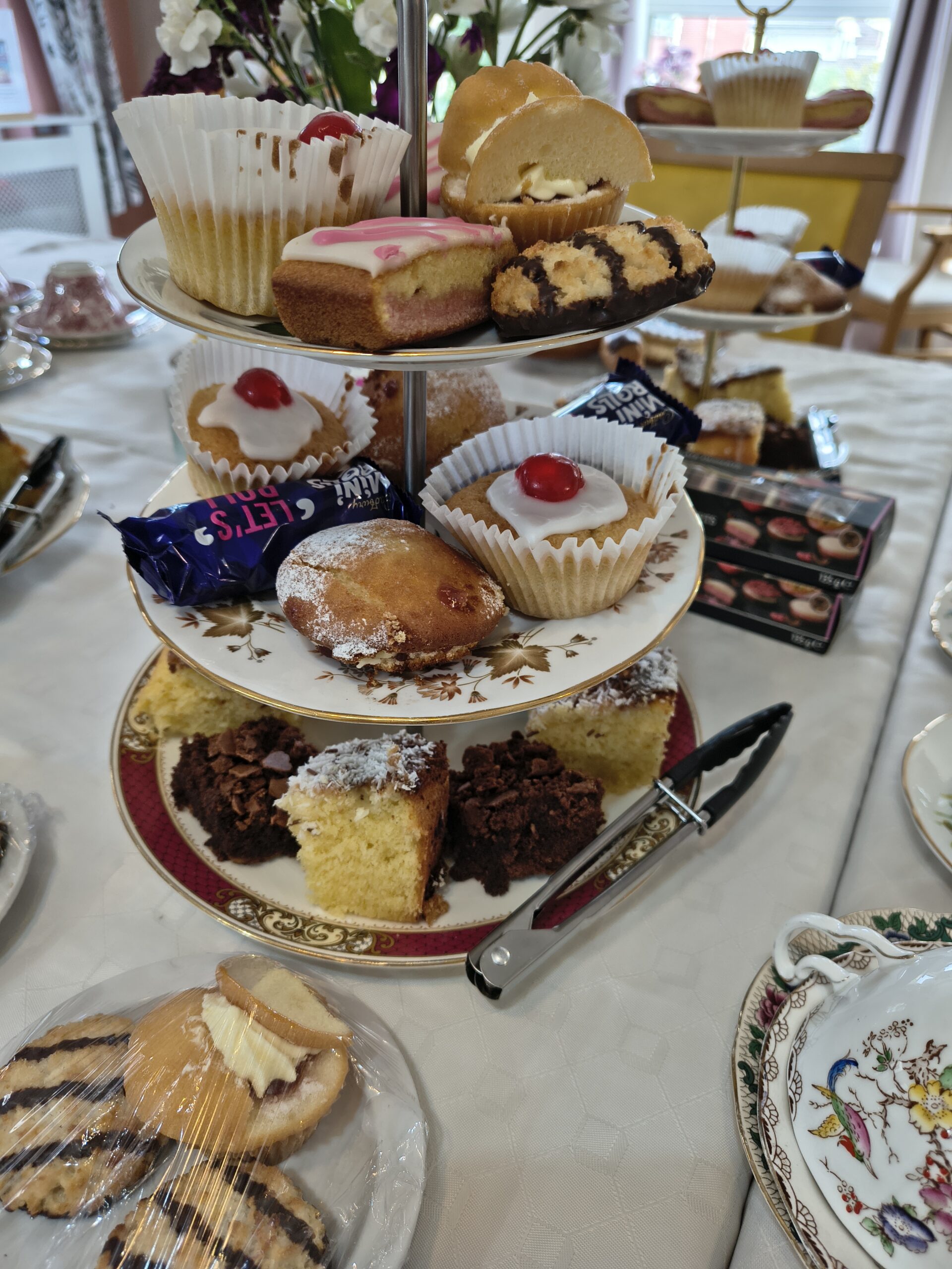 lose up of 3 tier plate of cakes scaled